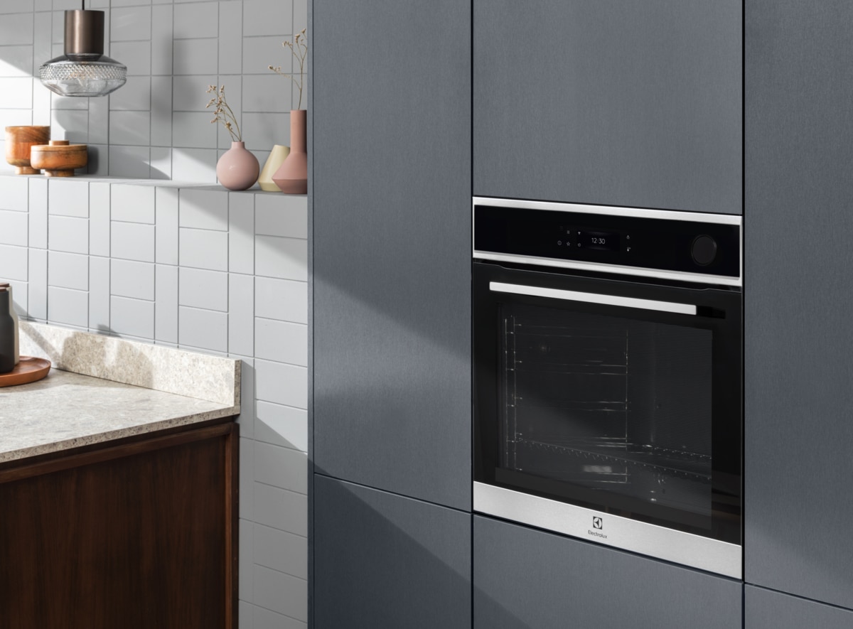 Electrolux built-in single oven installed in matte blue-grey kitchen cabinets