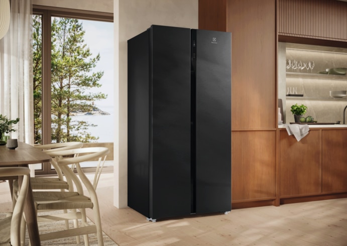 Black Electrolux side-by-side refrigerator in a modern kitchen