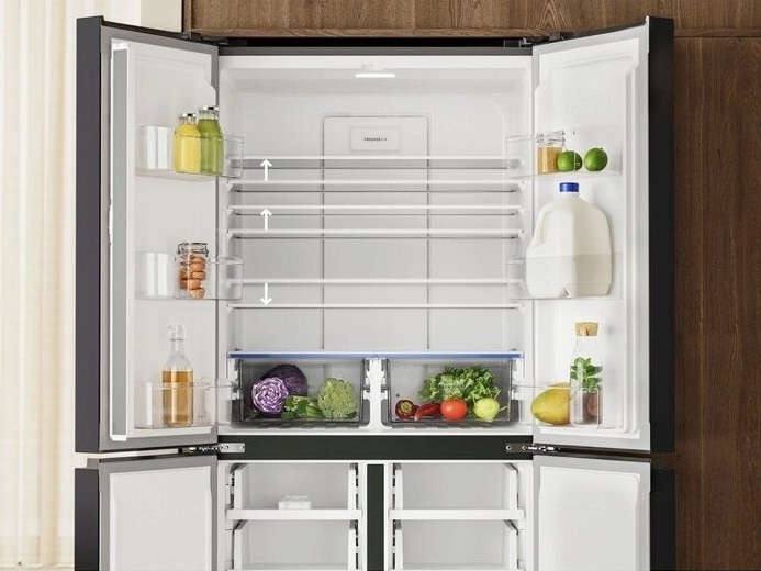 Four-door refrigerator interior showing adjustable shelves and drawers