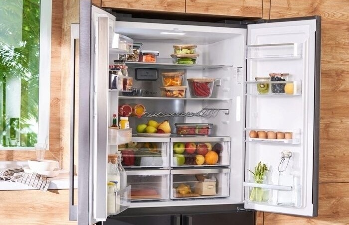 Open fridge stocked with food