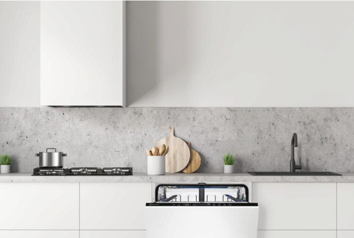 White minimalist kitchen with an open built-in dishwasher, gas hob and hood.