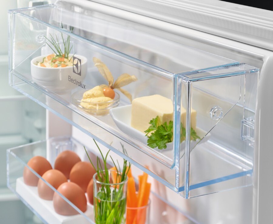 Eggs, butter, and dairy neatly arranged on Electrolux fridge door shelves