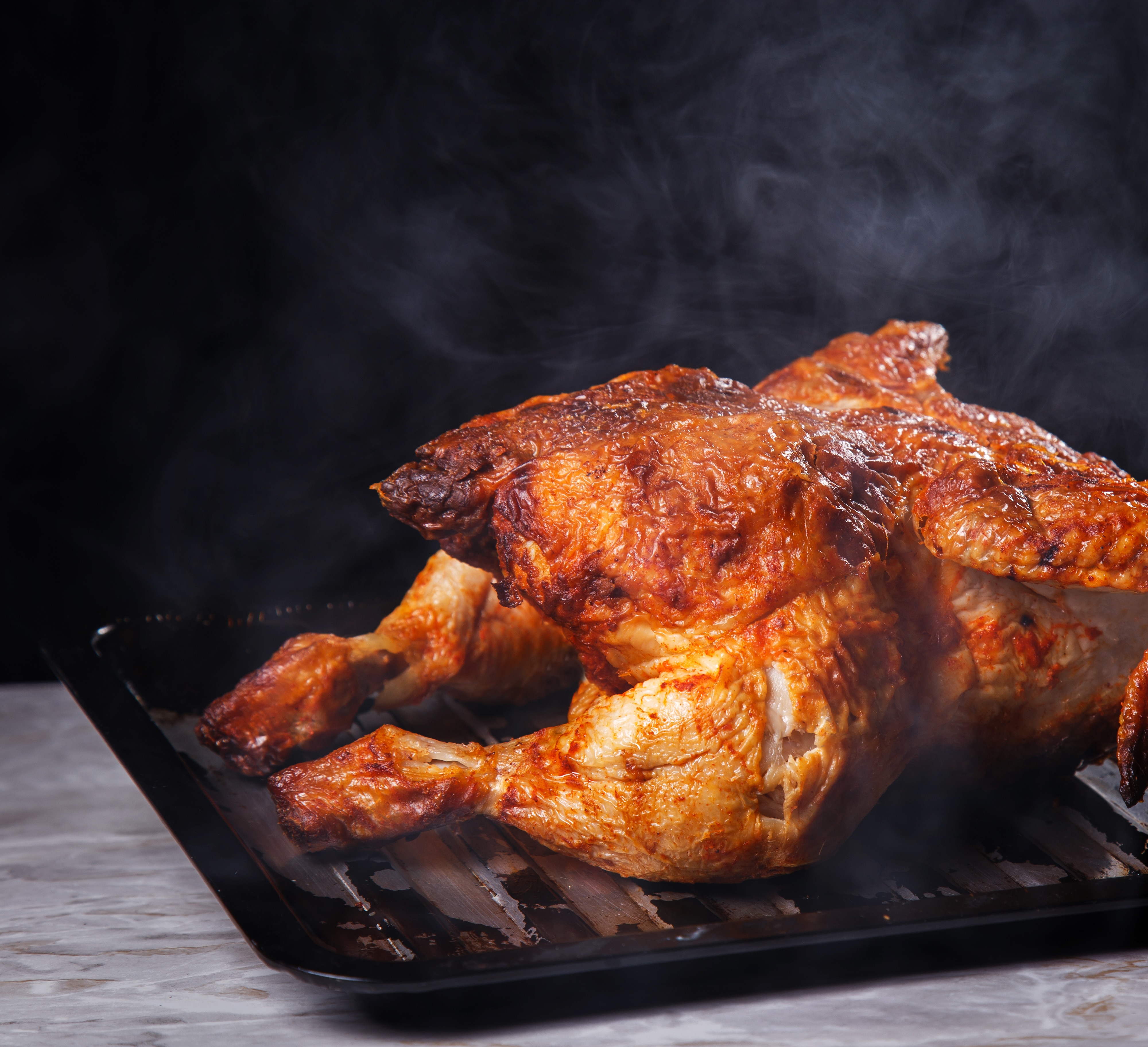 Baked chicken steaming hot from the oven